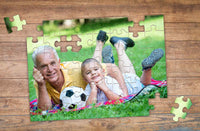 Thumbnail for 48 piece photo puzzle of Grandpa and Grandkid playing soccer in backyard | MakeYourPuzzles