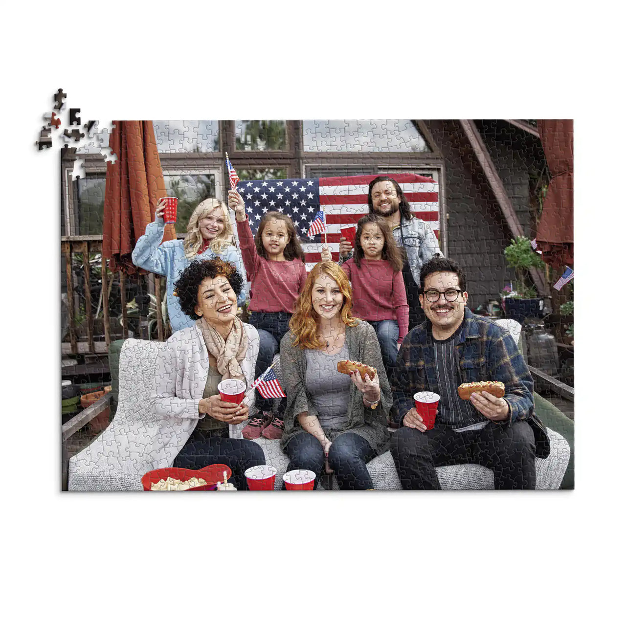 1000 piece 4th of July photo puzzle featuring a family celebrating with American flags and hot dogs.