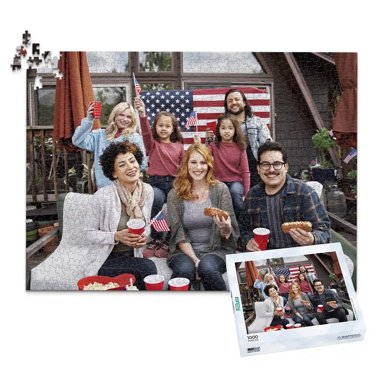 1000 piece 4th of July photo puzzle featuring a family celebrating with American flags and hot dogs, shown with its matching puzzle box