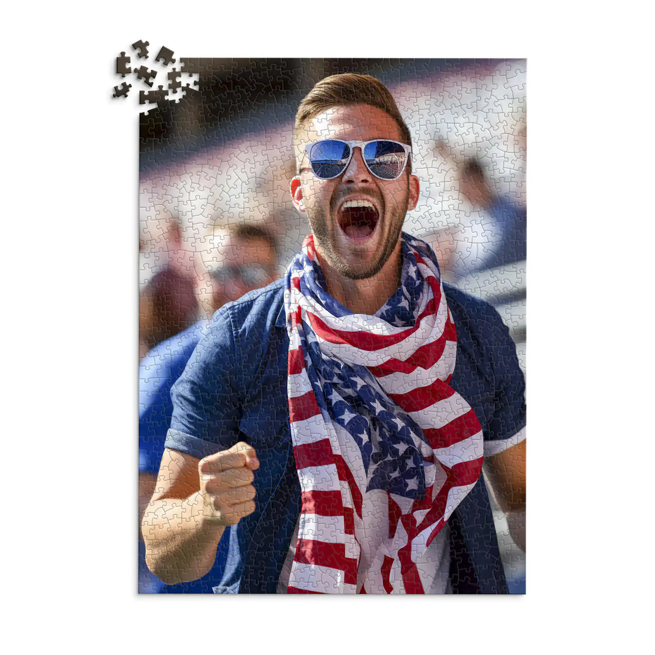 1000 piece 4th of July photo puzzle featuring a cheering man wearing an American flag scarf.