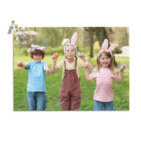 1000 piece Easter photo puzzle featuring three children wearing bunny ears and holding colorful Easter eggs.