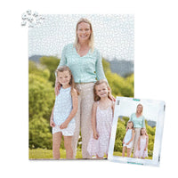 1000 piece personalized Mom puzzle featuring a mother with her two young daughters outdoors, shown with its matching puzzle box