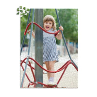 1000 piece personalized puzzle for kids showing a smiling young girl climbing playground ropes.