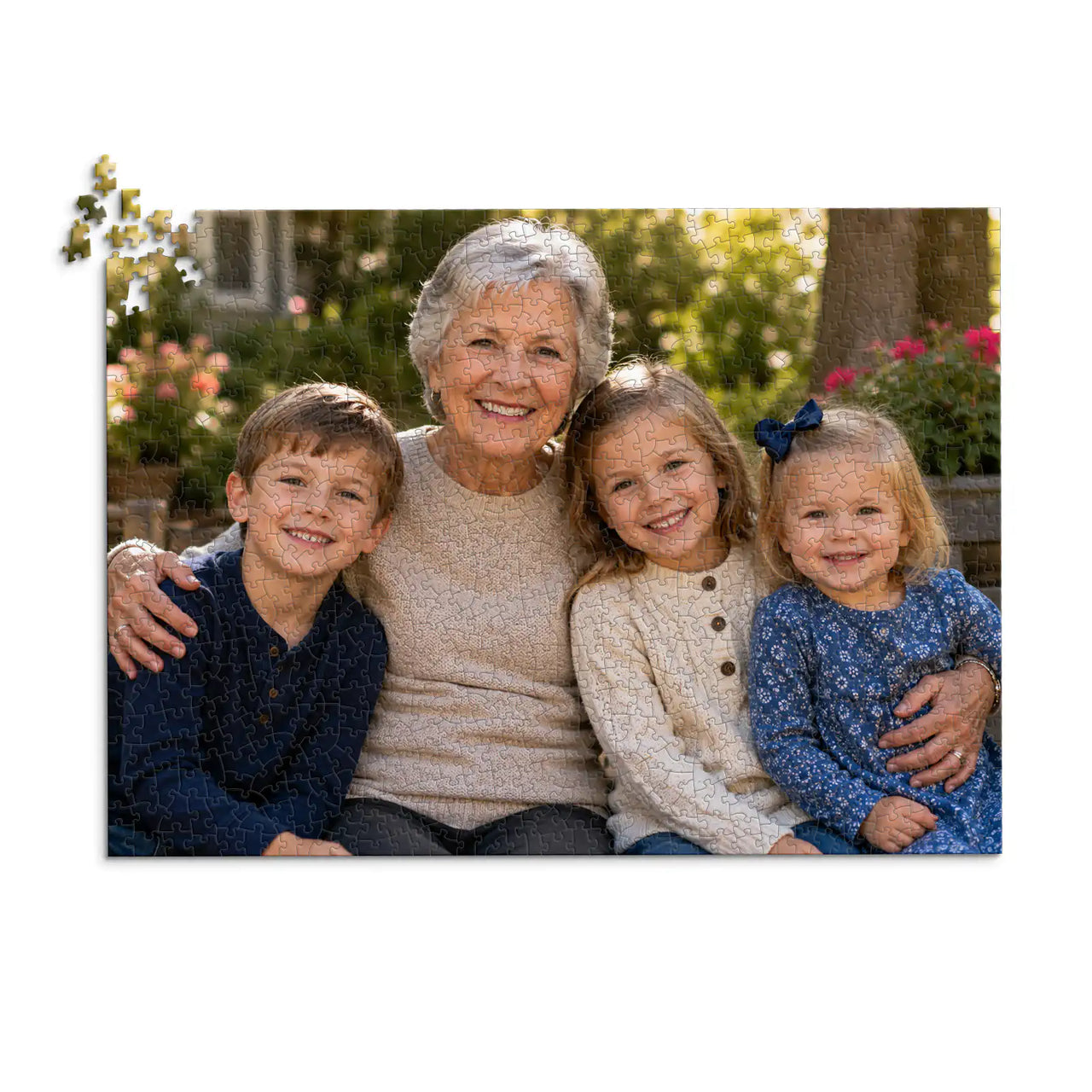 1000 piece personalized puzzle for grandparents showing a smiling grandmother with her three grandchildren.
