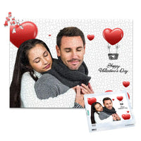 1000 piece personalized Valentine puzzle featuring a couple embracing with heart decorations, shown with its matching puzzle box