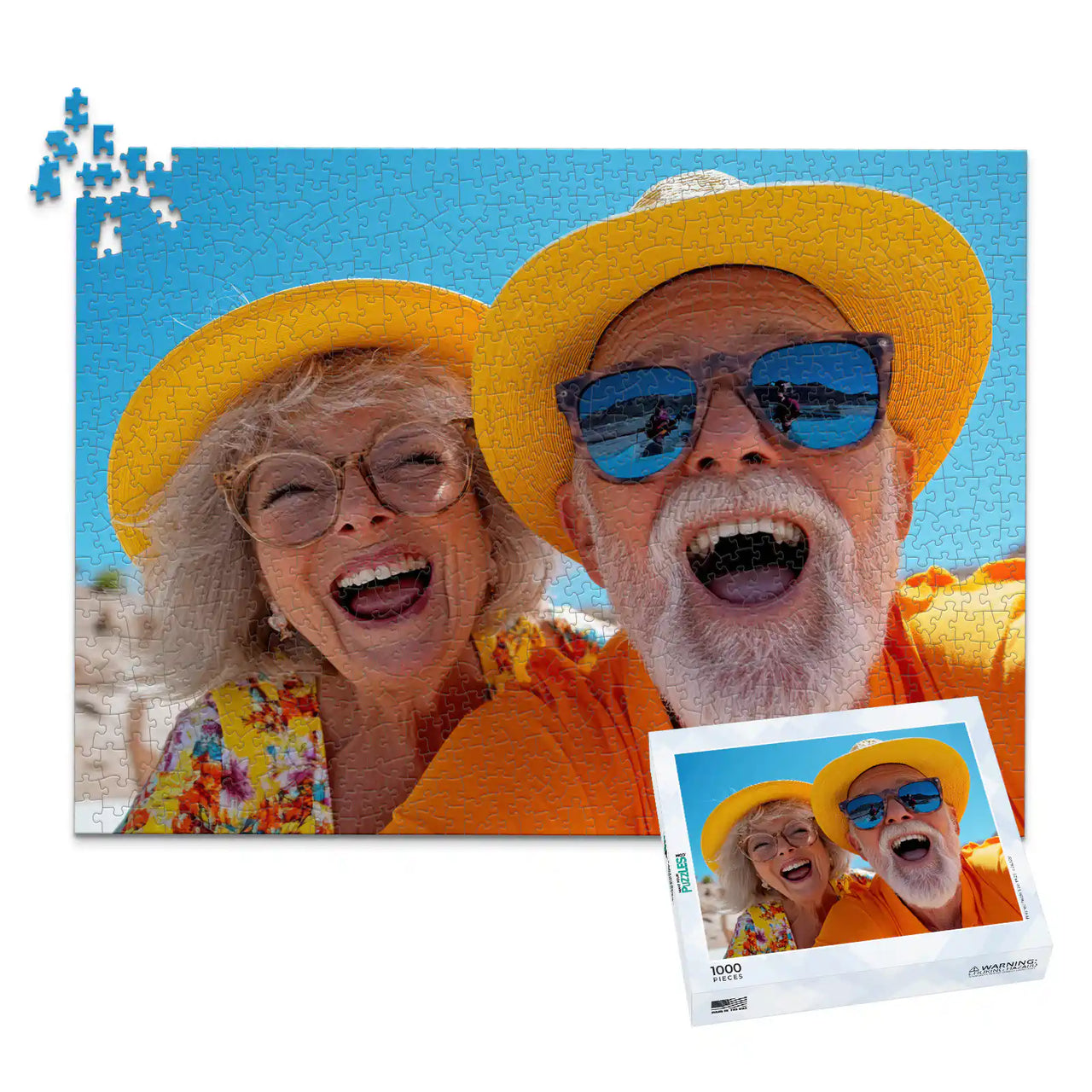 1000 piece personalized couple puzzle featuring a joyful older couple wearing sun hats at the beach, shown with its matching puzzle box