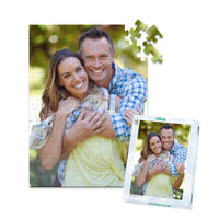 100 piece personalized couple puzzle featuring a smiling couple embracing outdoors, shown with its matching puzzle box