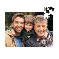 100 piece personalized Dad puzzle showing a smiling father, son and grandfather.