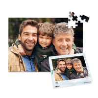 100 piece personalized Dad puzzle showing a smiling father, son and grandfather, displayed with the matching puzzle box.