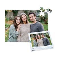 100 piece personalized Mom puzzle featuring a mother with her adult daughter and son outdoors, shown with its matching puzzle box