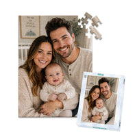 100 piece personalized puzzle for new parents showing a smiling mother and father with their baby, displayed with the matching puzzle box.