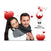 100 piece personalized Valentine puzzle featuring a couple embracing with heart decorations.