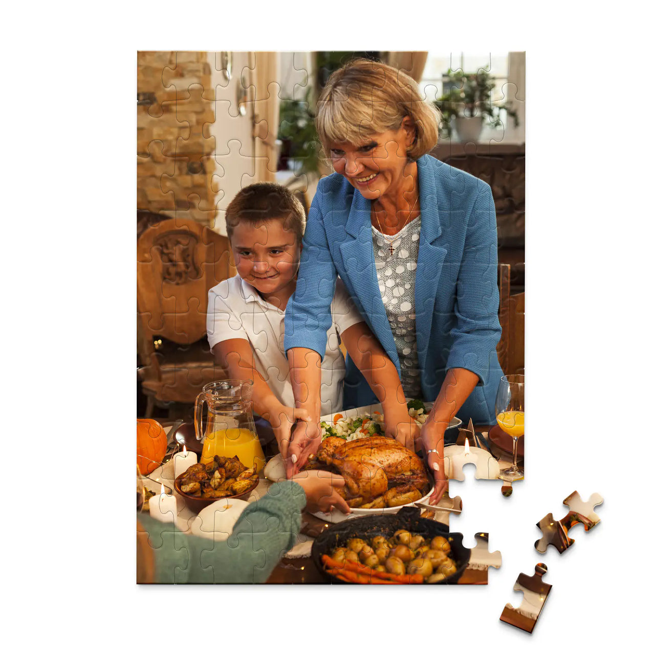 100 piece Thanksgiving photo puzzle featuring a grandmother and grandson serving turkey at a family dinner.