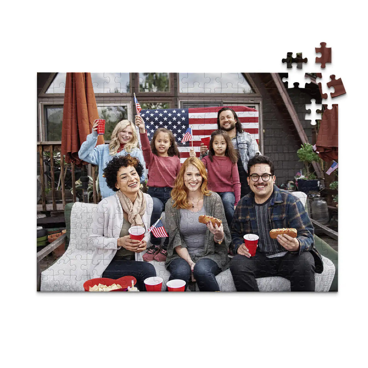 252 piece 4th of July photo puzzle featuring a family celebrating with American flags and hot dogs.