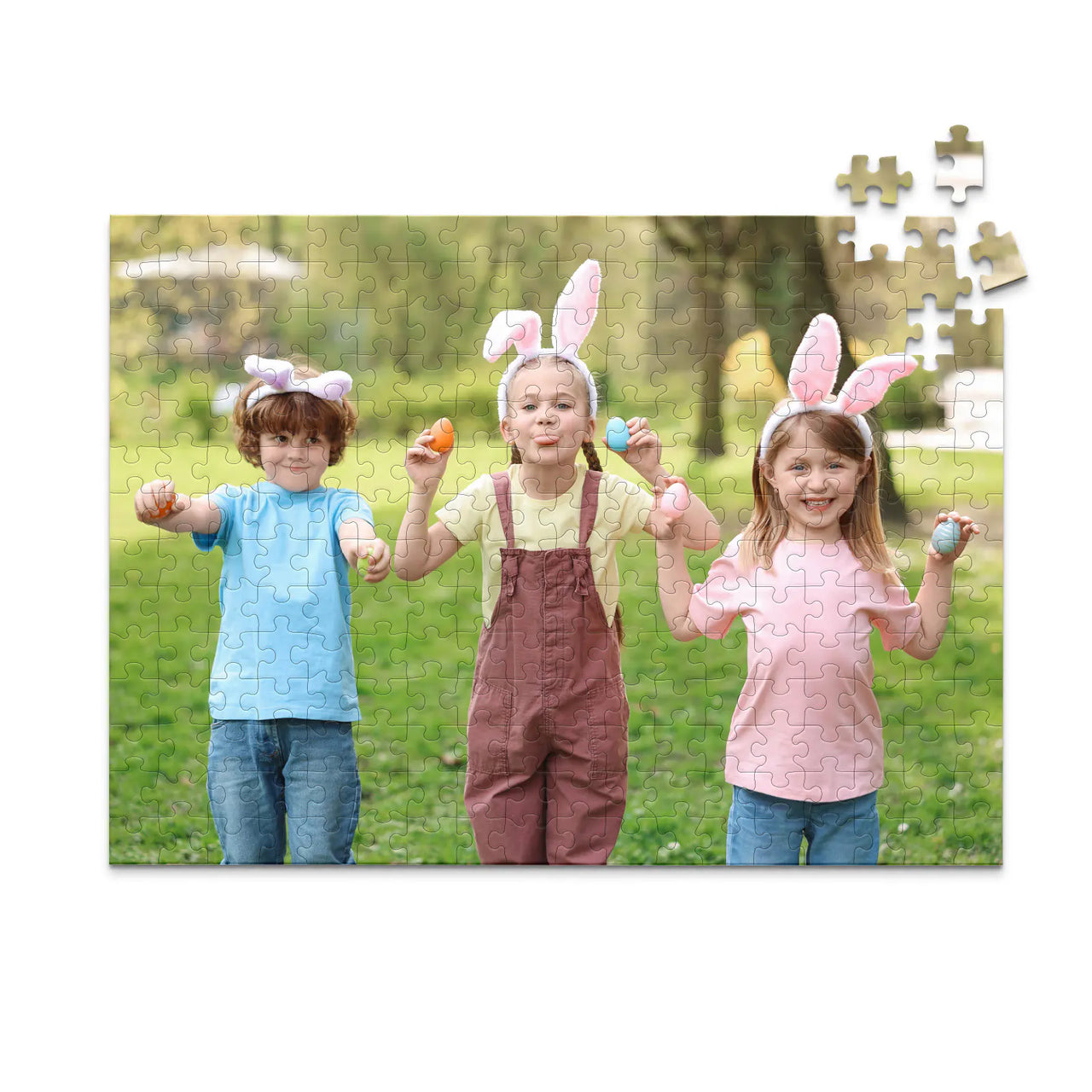 252 piece Easter photo puzzle featuring three children wearing bunny ears and holding colorful Easter eggs.