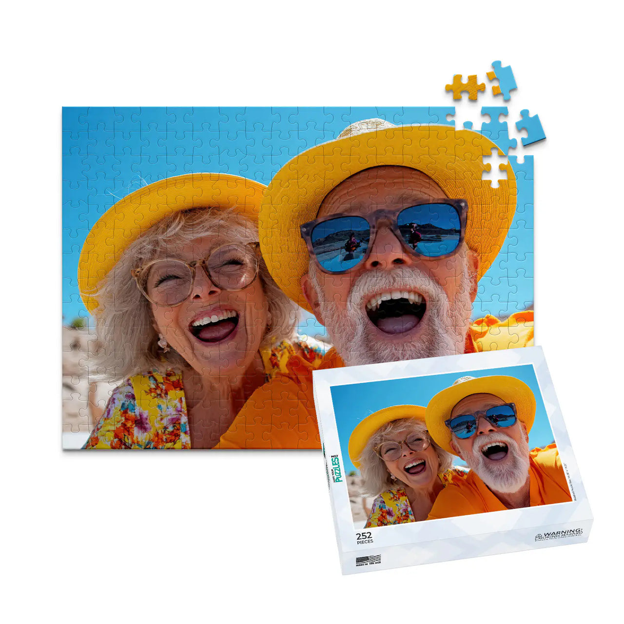 252 piece personalized couple puzzle featuring a joyful older couple wearing sun hats at the beach, shown with its matching puzzle box