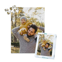 252 piece personalized Dad puzzle showing a smiling father carrying his baby on his shoulders, displayed with the matching puzzle box.