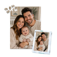 252 piece personalized puzzle for new parents showing a smiling mother and father with their baby, displayed with the matching puzzle box.