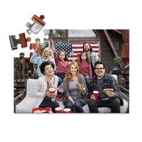 48 piece 4th of July photo puzzle featuring a family celebrating with American flags and hot dogs.