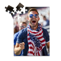 48 piece 4th of July photo puzzle featuring a cheering man wearing an American flag scarf.