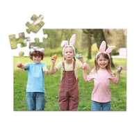 48 piece Easter photo puzzle featuring three children wearing bunny ears and holding colorful Easter eggs.