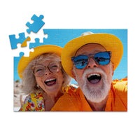 48 piece personalized couple puzzle featuring a joyful older couple wearing sun hats at the beach.