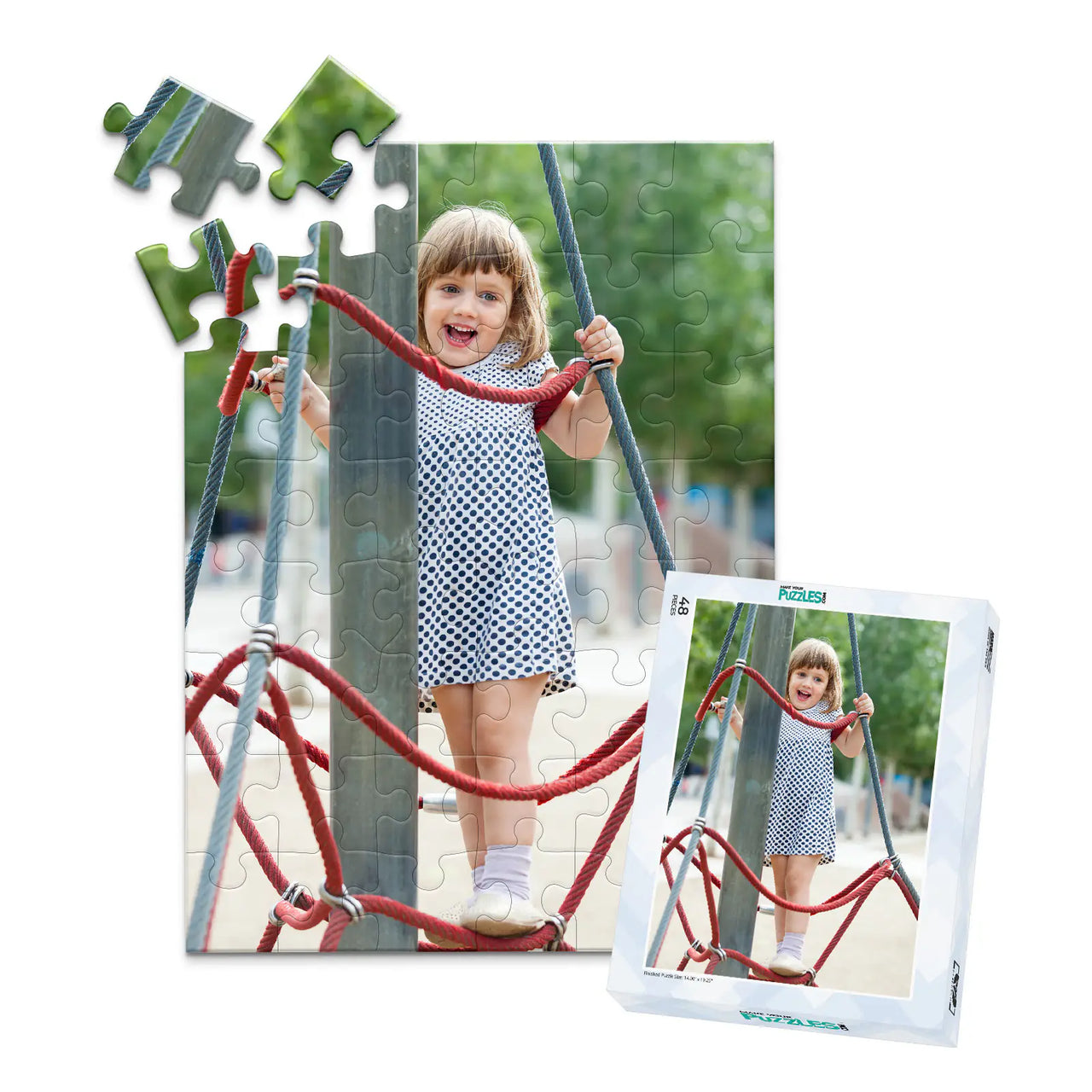 48 piece personalized puzzle for kids showing a smiling young girl climbing playground ropes, displayed with the matching puzzle box.