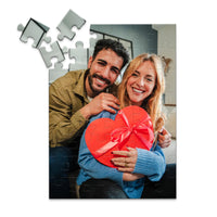 48 piece personalized Valentine puzzle featuring a smiling couple with a heart-shaped gift.