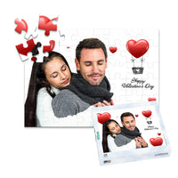 48 piece personalized Valentine puzzle featuring a couple embracing with heart decorations, shown with its matching puzzle box