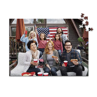 500 piece 4th of July photo puzzle featuring a family celebrating with American flags and hot dogs.