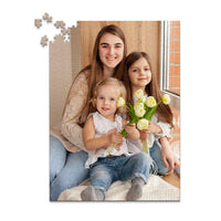 500 piece custom Mother’s Day photo puzzle featuring three daughters with flower.