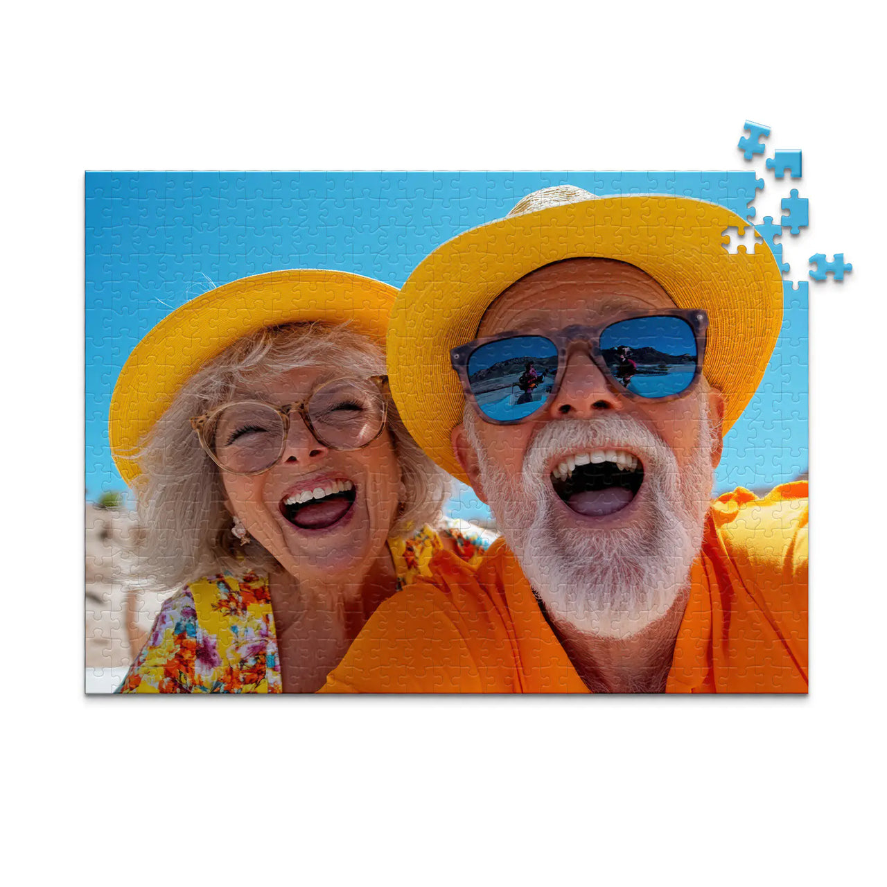 500 piece personalized couple puzzle featuring a joyful older couple wearing sun hats at the beach.