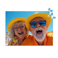 500 piece personalized couple puzzle featuring a joyful older couple wearing sun hats at the beach.