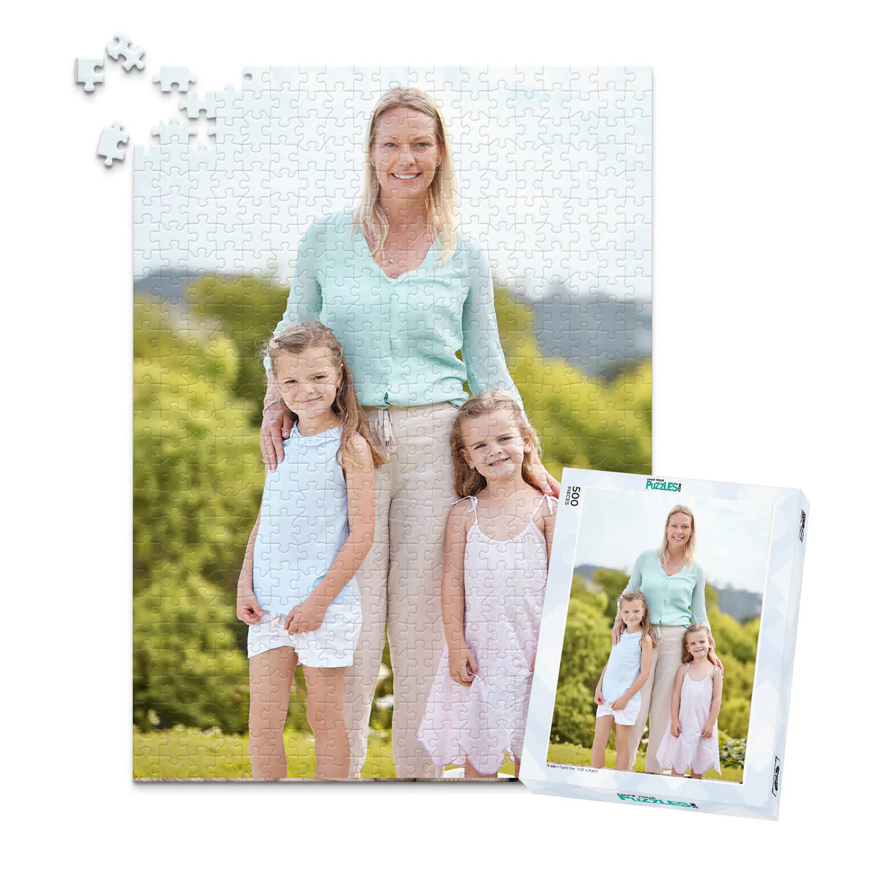 500 piece personalized Mom puzzle featuring a mother with her two young daughters outdoors, shown with its matching puzzle box