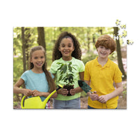 500 piece personalized puzzle for kids showing three smiling children gardening together.