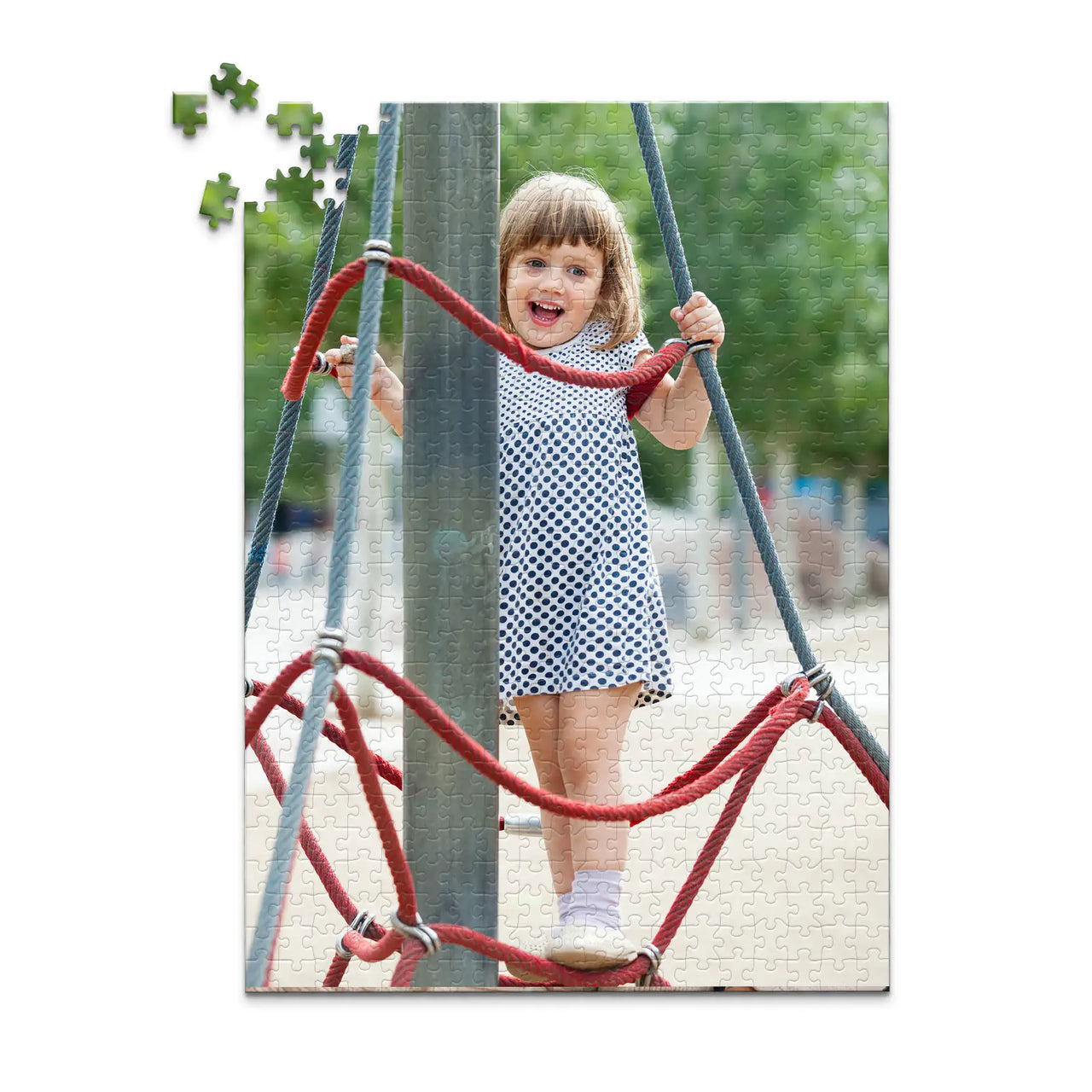 500 piece personalized puzzle for kids showing a smiling young girl climbing playground ropes.