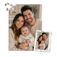 500 piece personalized puzzle for new parents showing a smiling mother and father with their baby, displayed with the matching puzzle box.
