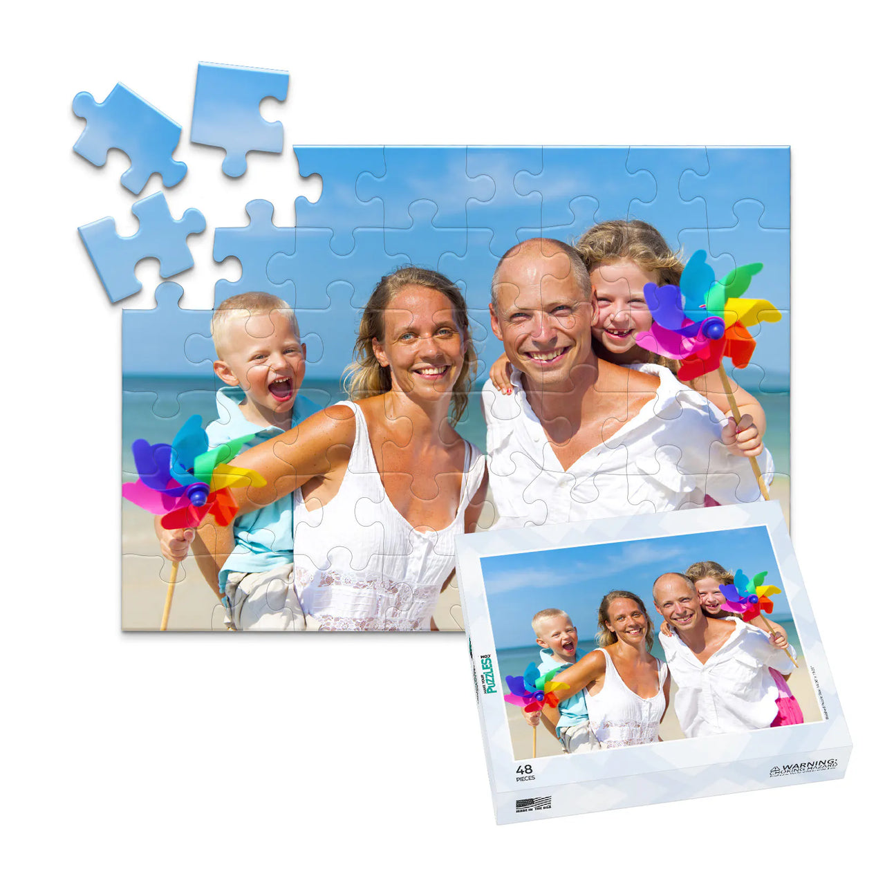Custom Travel Photo Puzzle 48 piece with matching puzzle box  showing a family with two young kids on a beach with blue sky