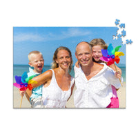 Custom Travel Photo Puzzle 500 piece showing a family with two young kids on a beach with blue sky