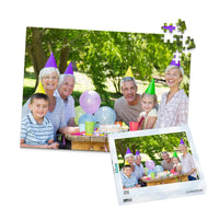 Personalized Birthday Puzzle Landscape orientation 252 Pieces and matching puzzle box showing a family portrait of six people celebrating a birthday outdoors