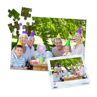 Personalized Birthday Puzzle Landscape orientation 48 Pieces and puzzle box showing a family portrait of six people celebrating a birthday outdoors
