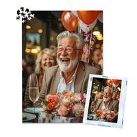 Personalized Birthday Puzzle 1000 Pieces with matching puzzle box featuring a photo of a smiling older man with a white beard and glasses, wearing a brown blazer, seated at a table with balloons, flowers, and a champagne flute.