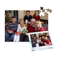 100 piece personalized Christmas puzzle featuring a family opening gifts, shown with its matching puzzle box